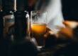 clear drinking glass with yellow liquid