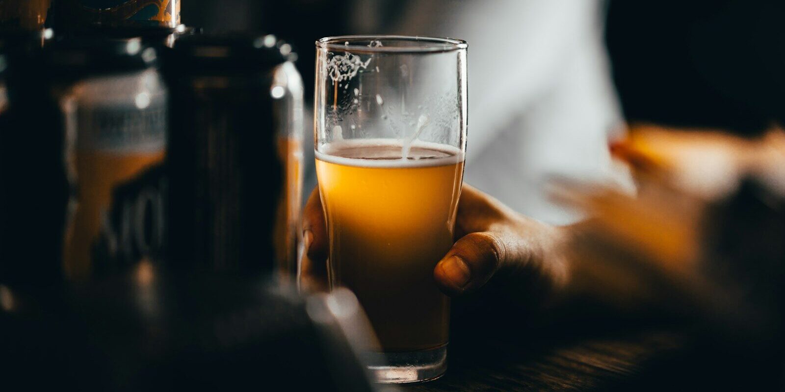 Photo by Josh Olalde clear drinking glass with yellow liquid