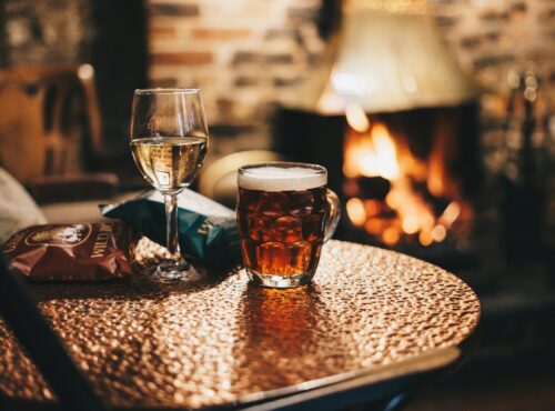 Photo by Ambitious Studio* | Rick Barrett clear drinking glass with brown liquid on brown wooden table